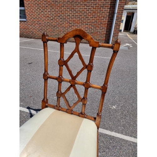 1080 - An unusual set of ten carved beech dining chairs, to include a pair of elbow chairs, in the Chinese ... 