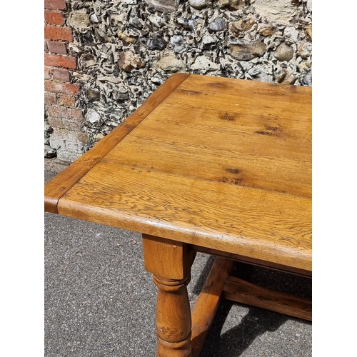 1095 - A good reproduction oak refectory table, with cleated end five-plank top, the top 213 x 106.5cm.... 