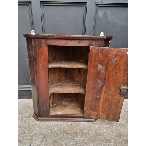 1101 - An 18th century solid yew hanging corner cupboard, 85.5cm high x 77cm wide.