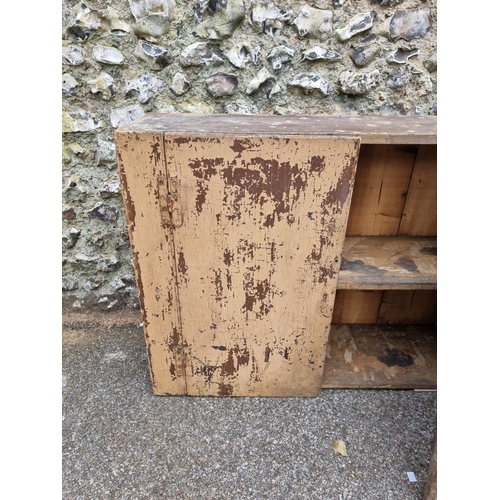 1103 - An 18th century primitive painted wall cupboard, 76cm high x 100cm wide.