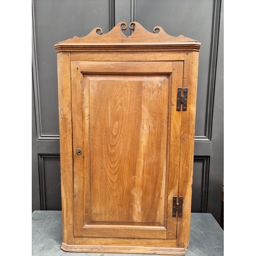 1105 - An unusual 18th century solid walnut hanging corner cupboard, 108cm high x 64cm wide.... 