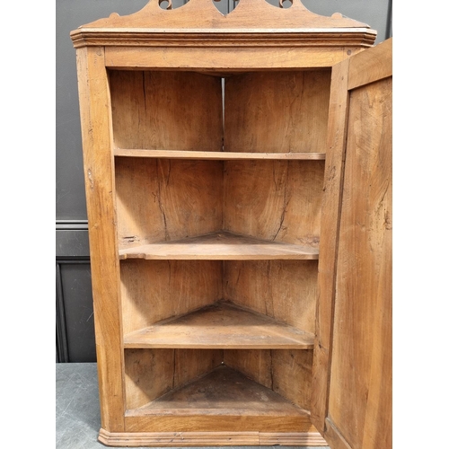 1105 - An unusual 18th century solid walnut hanging corner cupboard, 108cm high x 64cm wide.... 