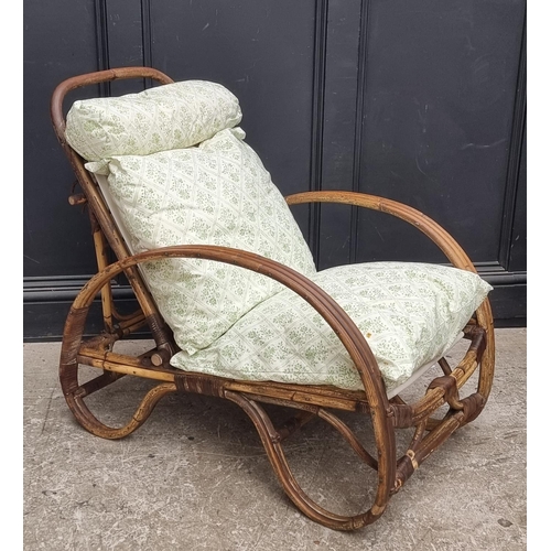 1106 - A vintage bamboo steamer type chair, labelled 'Angrave's'.