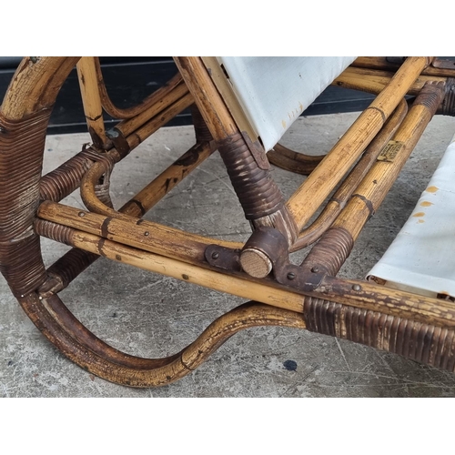 1106 - A vintage bamboo steamer type chair, labelled 'Angrave's'.