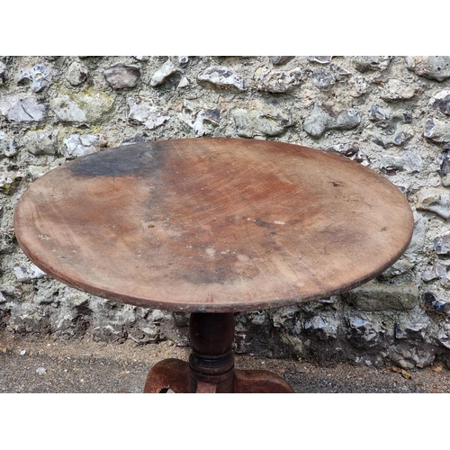 1110 - A George III mahogany tilt-top tripod table, 84cm diameter.