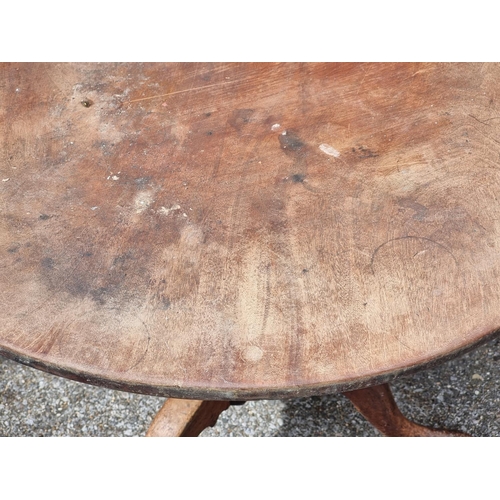 1110 - A George III mahogany tilt-top tripod table, 84cm diameter.