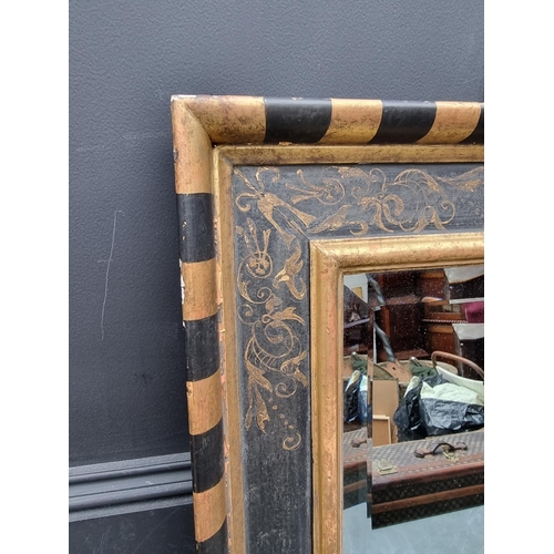 1120 - A gilt and ebonised frame rectangular wall mirror, 79.5 x 64.5cm.