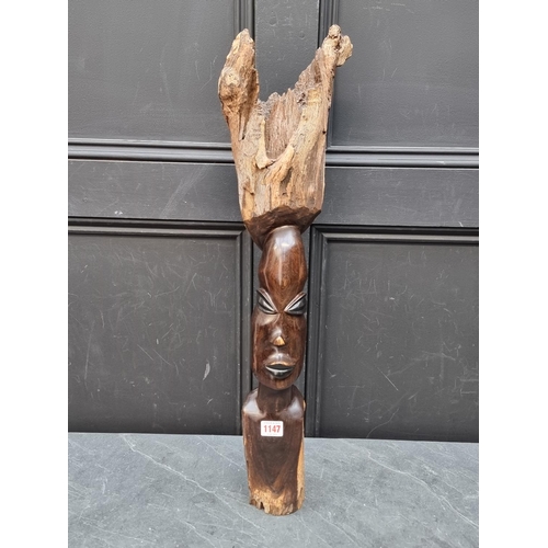 1147 - Ethnographica: an African ebony figure, 70cm high.