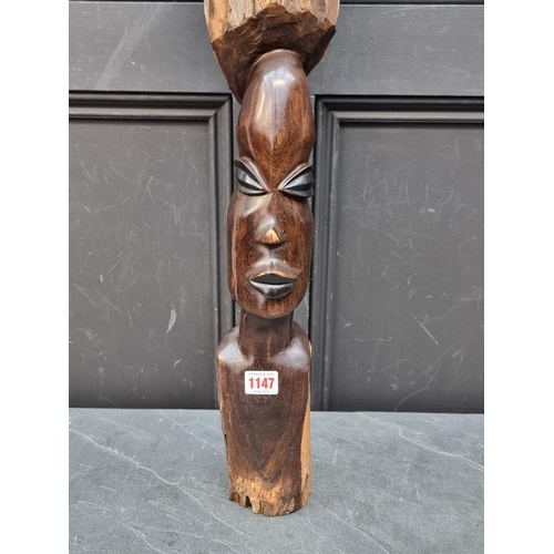 1147 - Ethnographica: an African ebony figure, 70cm high.