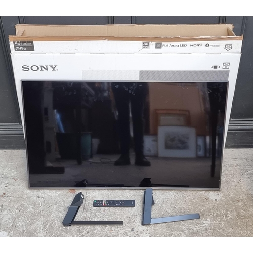 1162 - A Sony XH95 49in television, with stand and remote control, boxed.