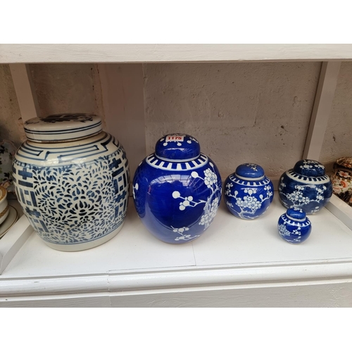 1175 - Six Chinese blue and white ginger jars and covers, largest 24cm high. 