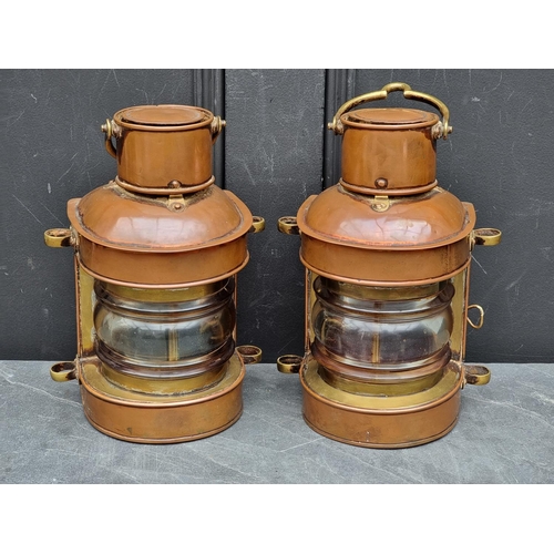 1204 - A pair of antique copper and brass ship's lanterns, 24cm high.