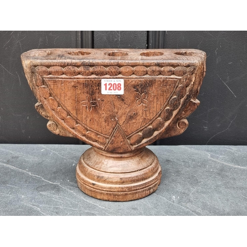 1208 - Ethnographica: an Indian carved hardwood rice planter or seed drill, 27cm wide.