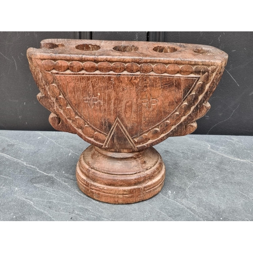 1208 - Ethnographica: an Indian carved hardwood rice planter or seed drill, 27cm wide.