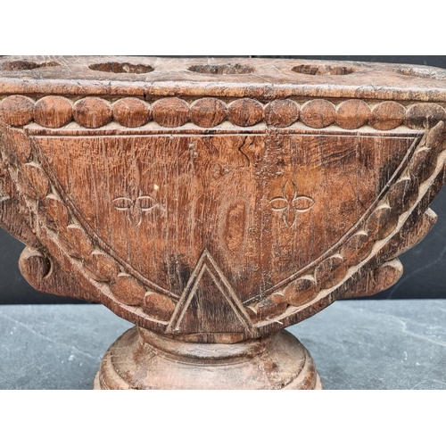 1208 - Ethnographica: an Indian carved hardwood rice planter or seed drill, 27cm wide.