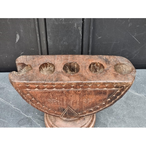 1208 - Ethnographica: an Indian carved hardwood rice planter or seed drill, 27cm wide.