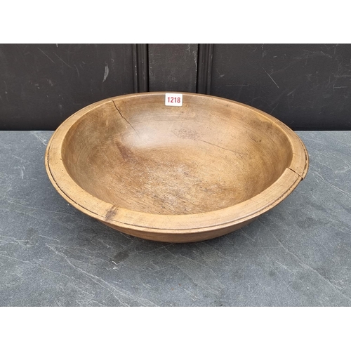 1218 - An antique sycamore circular bowl, 40cm diameter.