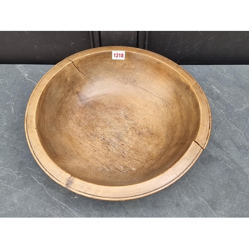 1218 - An antique sycamore circular bowl, 40cm diameter.