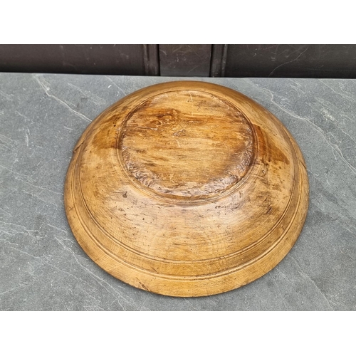 1218 - An antique sycamore circular bowl, 40cm diameter.