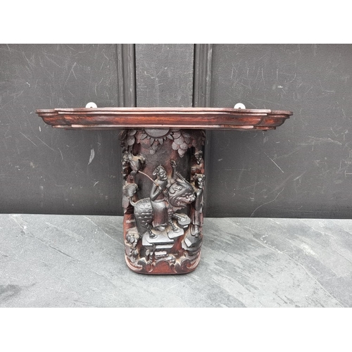 1225 - WITHDRAWN FROM SALE An oak wall bracket, carved in chinoiserie style, 39.5cm wide.