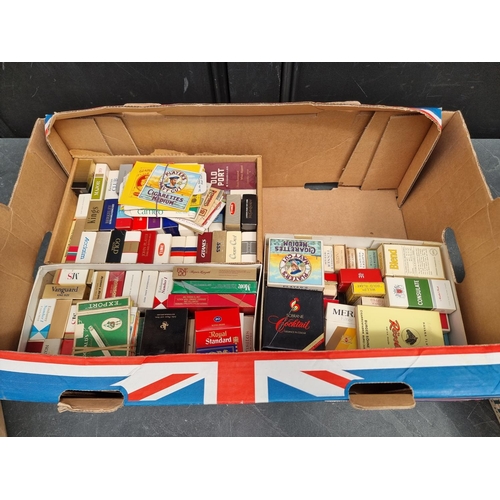 1239 - A large quantity of cigarette packets and related, (no contents).