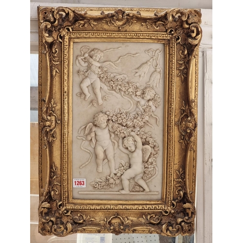 1263 - A composition marble relief plaque of putti, 37 x 21.5cm.