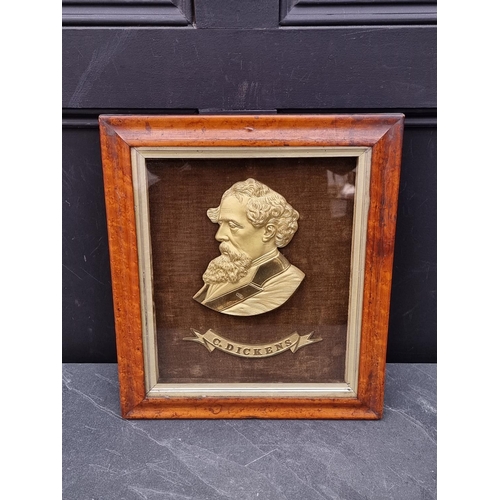 1284 - A gilt metal plaque of Charles Dickens, finely detailed, framed and glazed, the whole 40.5 x 35.5cm.... 