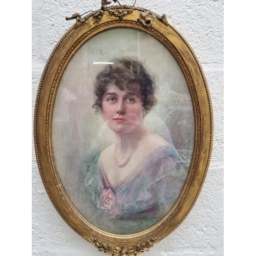 1315 - Dorothy M Morgan, head and shoulders portrait of a young lady, signed, watercolour, 48 x 33cm oval.... 