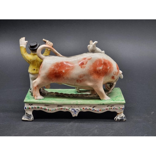 1352 - An early 19th century Pearlware 'Bull Baiting' figure group, by Obadiah Sherratt, 18.5cm wide.... 