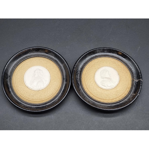 1359 - A pair of 19th century buff pottery pot lids, each decorated with a Renaissance style portrait, in e... 