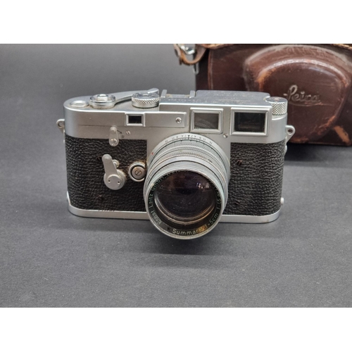 1361 - Cameras: a Leica M3, serial No.700243, in original leather case; with Leica Meter MC; and Summarit f... 