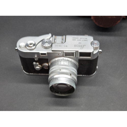 1361 - Cameras: a Leica M3, serial No.700243, in original leather case; with Leica Meter MC; and Summarit f... 