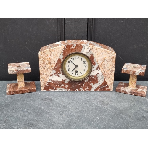 1369 - An Art Deco marble clock garniture, the clock 20cm high, (the side urns incomplete).... 