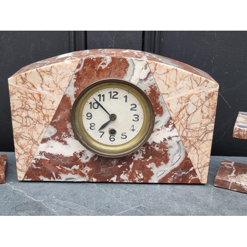 1369 - An Art Deco marble clock garniture, the clock 20cm high, (the side urns incomplete).... 