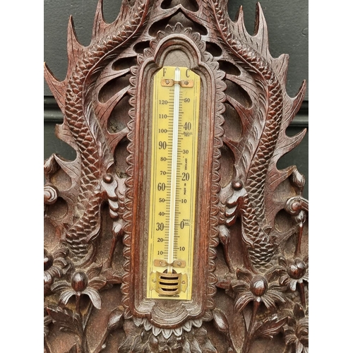 1376 - A Chinese carved hardwood framed aneroid barometer, 59cm high.