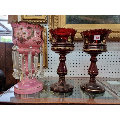 1379 - A pair of ruby glass lustres, 34.5cm high, (lacking drops); together with another pink glass ex... 