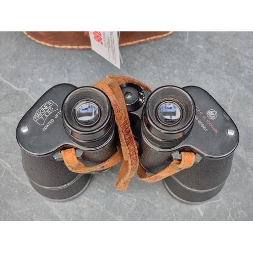 1386 - A pair of Mariner 7x50 binoculars, in leather case.