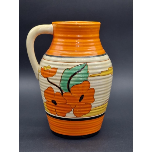 1523 - A Clarice Cliff 'Red Roofs' Lotus jug, 29.5cm high.