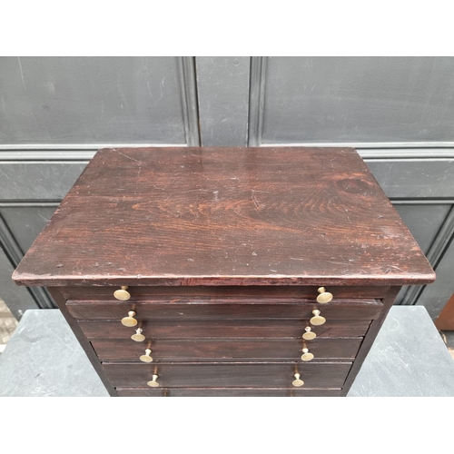 1006 - An old stained pine collectors' type chest, 56.5cm high x 44.5cm wide.