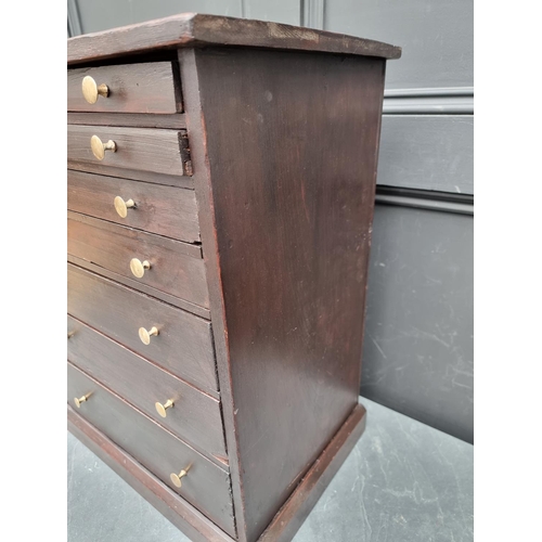 1006 - An old stained pine collectors' type chest, 56.5cm high x 44.5cm wide.