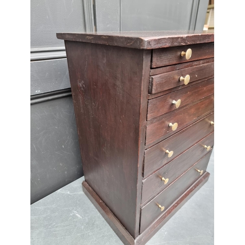 1006 - An old stained pine collectors' type chest, 56.5cm high x 44.5cm wide.