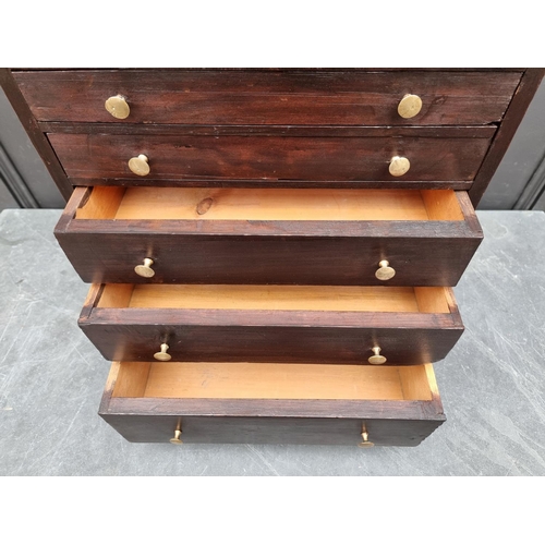 1006 - An old stained pine collectors' type chest, 56.5cm high x 44.5cm wide.