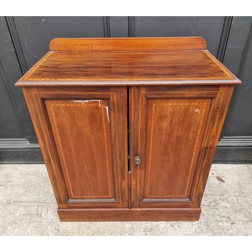 1009 - An Edwardian mahogany and satinwood chest of drawers, 84cm wide; together with a similar cupboard, 7... 