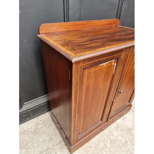 1009 - An Edwardian mahogany and satinwood chest of drawers, 84cm wide; together with a similar cupboard, 7... 