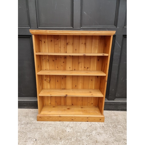 1013 - A pine open bookcase, 96.5cm wide.