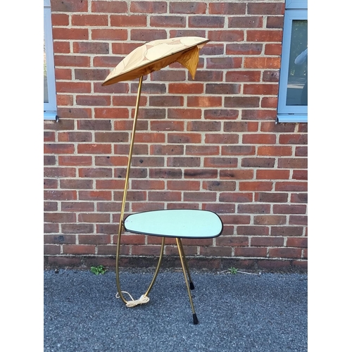 1033 - A mid-century brass lamp table, probably Italian, with original shade, approx. 155cm high.... 