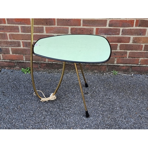 1033 - A mid-century brass lamp table, probably Italian, with original shade, approx. 155cm high.... 