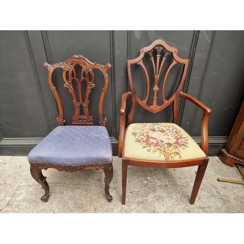 1084 - A late Victorian carved mahogany dining chair; together with another early 20th century mahogany elb... 