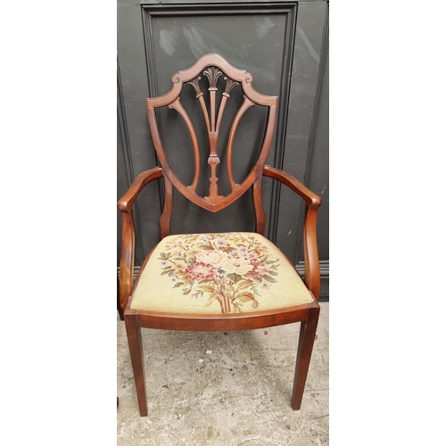 1084 - A late Victorian carved mahogany dining chair; together with another early 20th century mahogany elb... 