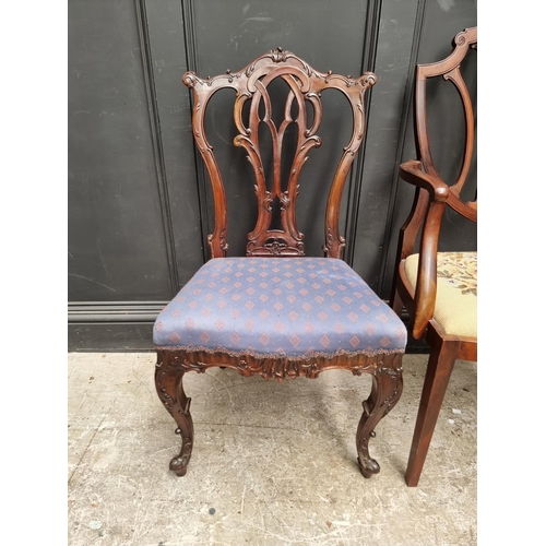 1084 - A late Victorian carved mahogany dining chair; together with another early 20th century mahogany elb... 